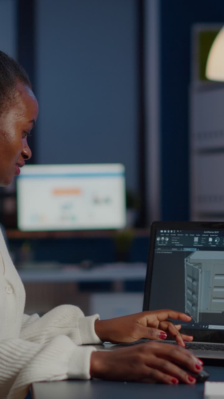 Vertical video Enthusiastic african engineer analysing cad software to design a 3D container