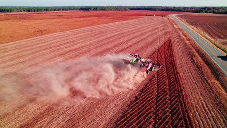 dusty combine harvesting soy field, georgia, usa