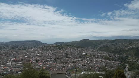 flying over the hill in quito, ecuador, showing the whole city