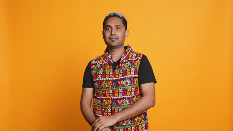 portrait of joyful man celebrating, studio background