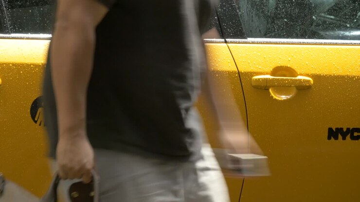 Man Getting out of Taxi in New York