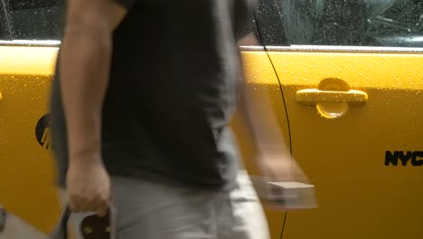 man getting out of taxi in new york