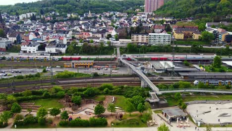 bingen am rhein town park and train station in germany, descending aerial