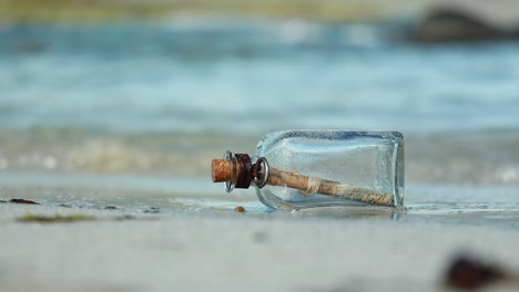 message in the bottle against the sun setting down