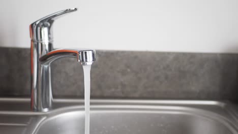 running water from kitchen faucet