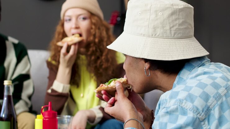 Four friends eating at home