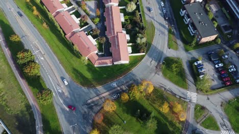 Aerial-tracks-cars-driving-on-picturesque-city-streets-in-Finland