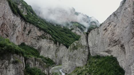 mountain valley with fog and cliffs