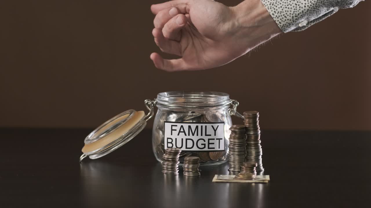 Close up of Man Saving Money for Family Budget