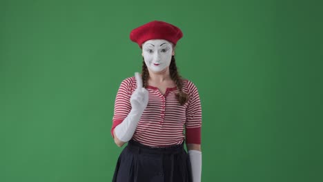 mime artist saying no by waving finger