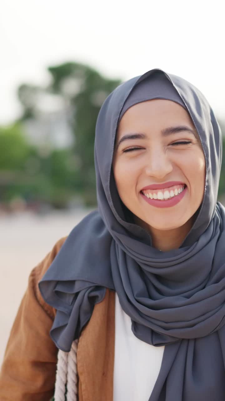 Happy Muslim Woman in Hijab Laughing and Celebrating