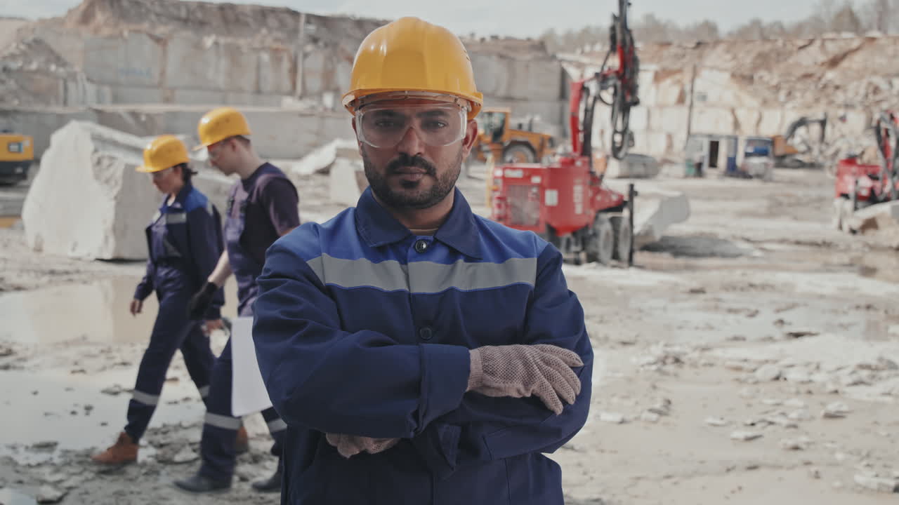 Male Worker Posing for Camera in Quarry