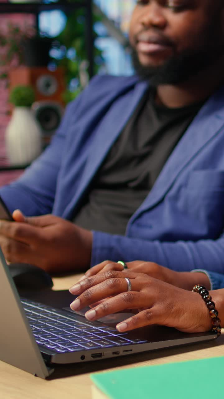 African American Business Partners Collaborating on Laptop and Tablet