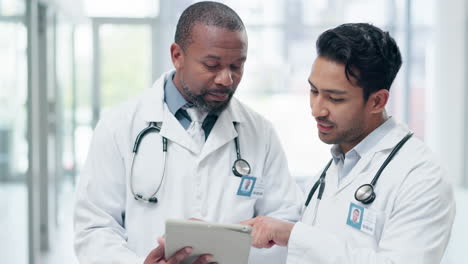 Hospital,-doctors-and-men-on-tablet-in-discussion