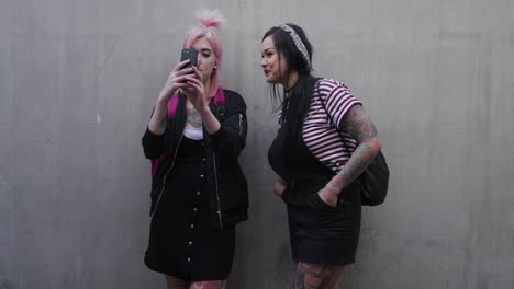 portrait young punk girls taking selfie photo using smartrphone enjoying relaxed urban lifestyle connectedness