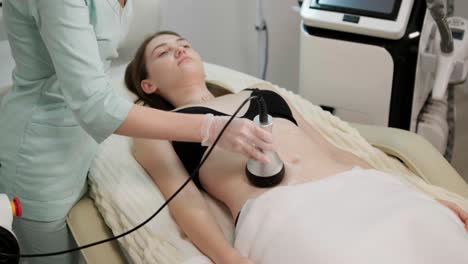 body rf lifting procedure. woman getting anti-cellulite and anti-fat therapy