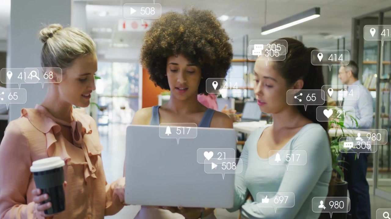 Colleagues clicking trackpad activating floating metrics icons monitoring social media engagement