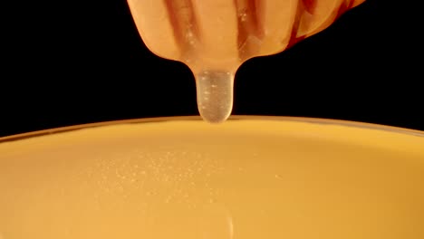 honey dripping from dipper
