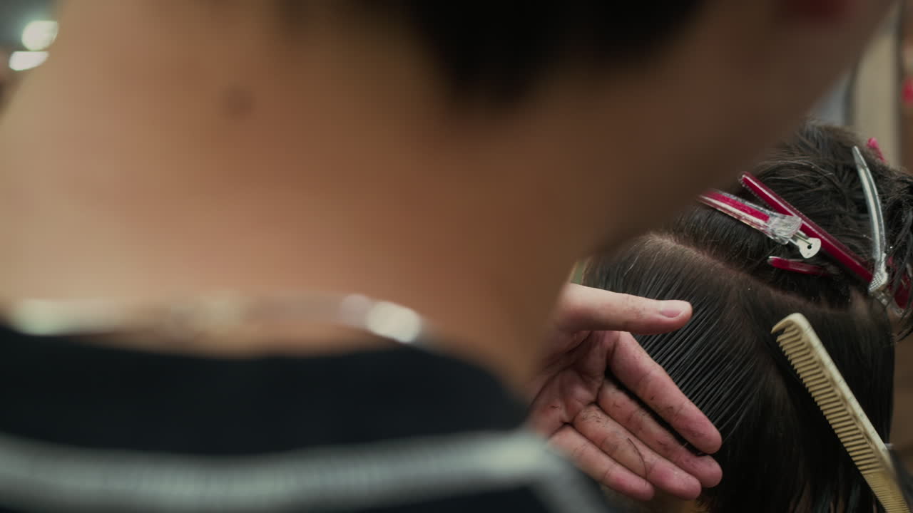 Haircut in progress at a barber shop