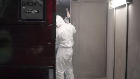 industrial painting process in a paint booth