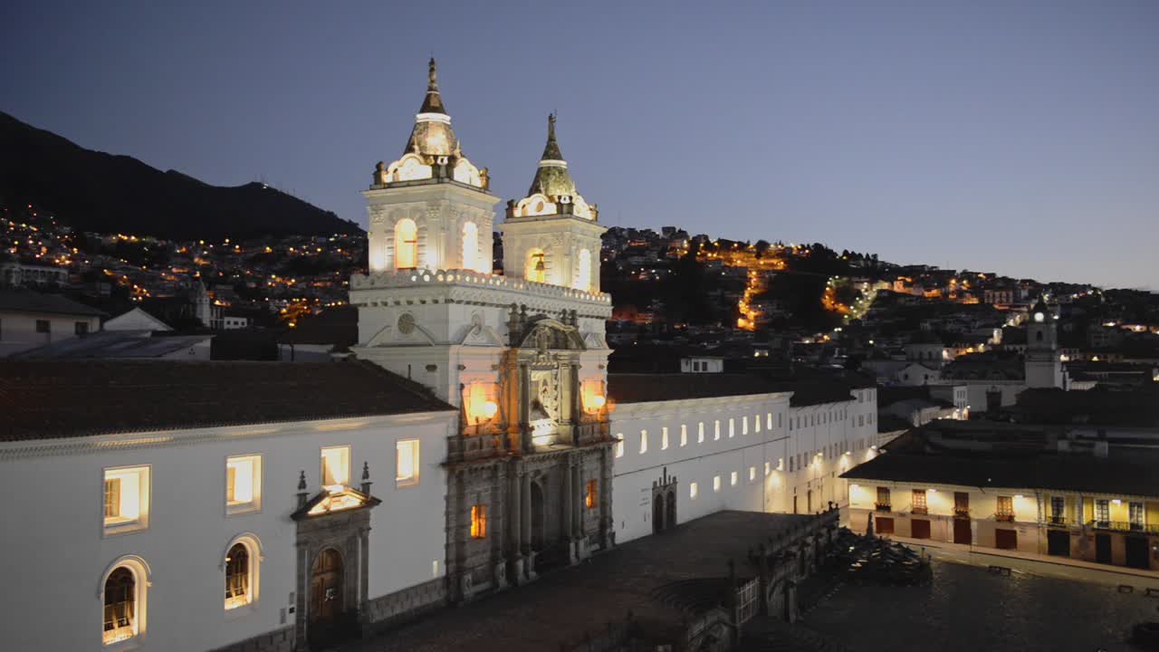 Cityscape mountain view over San Francisco church, Quito, Ecuador, at twilight