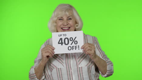 Senior-grandmother-showing-Sale-40-percent-Off-banner-advertisement.-Online-shopping.-Black-Friday