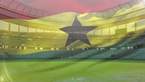 flag blowing in front of a stadium