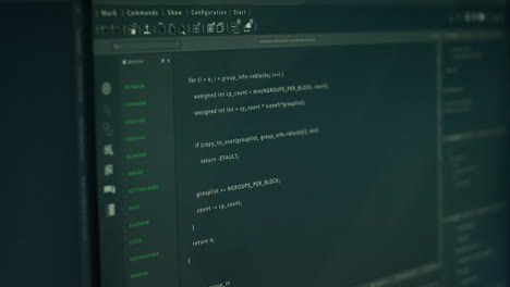 close up of lines of code running on computer display in modern data center