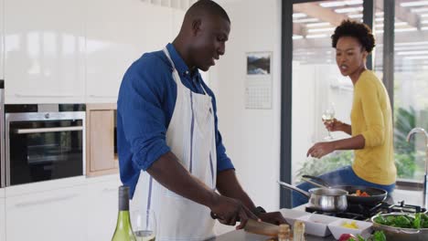 Video-of-happy-african-american-couple-cooking-together