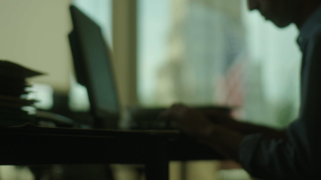 Person Working at a Desk in an Office