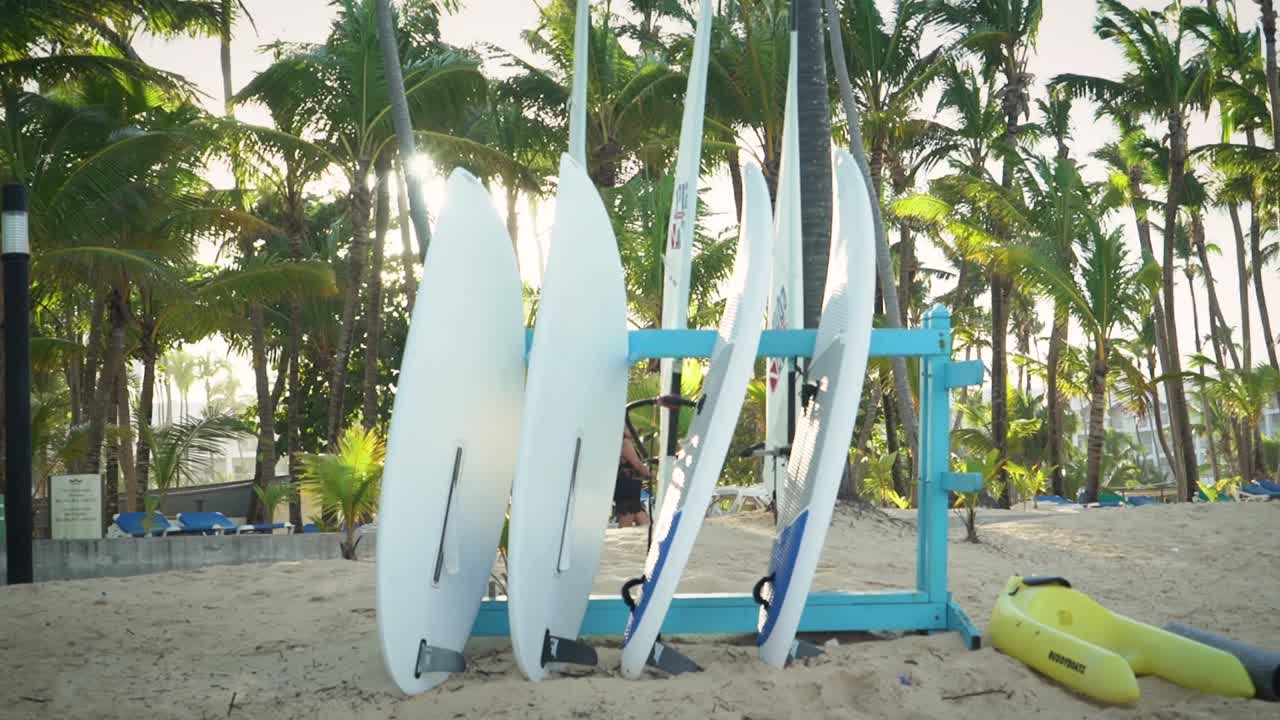 Rent of surfing boards on the sand beach during how summer vacation day with family