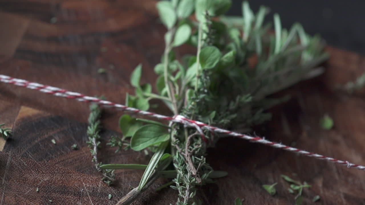 red and white ribbon pulling seasonings together on wooden ground