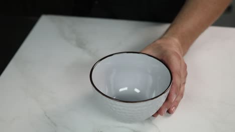 pouring chocolate pieces into a bowl