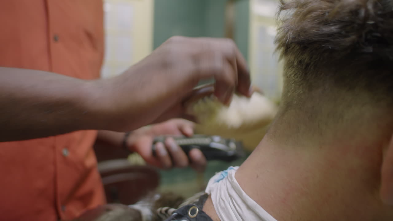 Barber Cleaning Neck of Client with Brush