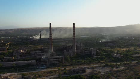 ruined thermal plant with tall chimneys in rustavi, georgia