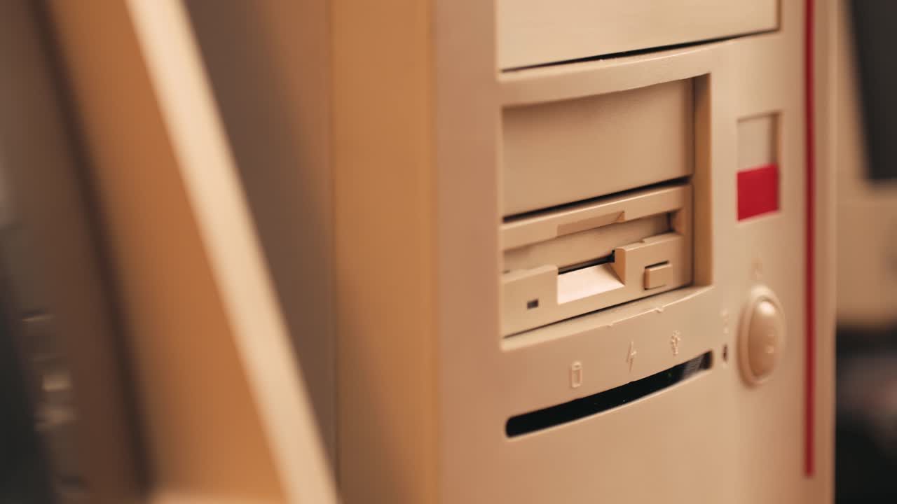 Using diskette for old computer. Music recorder, playing retro computer games. Vintage device for office, obsolete technology. . High quality 4k footage