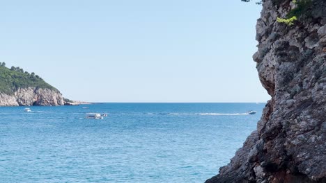 tourists kayaking in the sea near the old town in dubrovnik, croatia