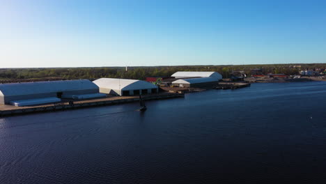 aerial view of industrial waterfront in pärnu, estonia wih warehouses and hangars