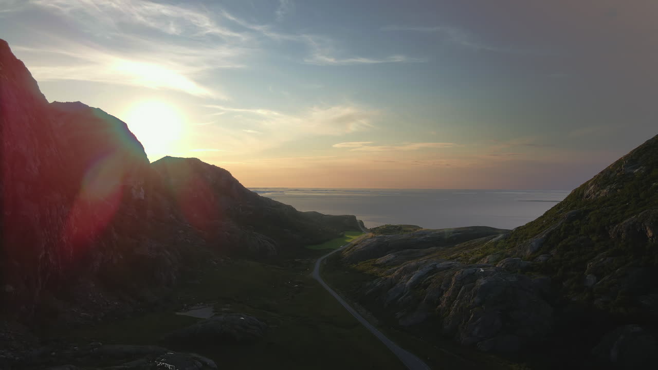 Beautiful Sunset Behind The Mountain In Dønna, Nordland County, Norway - aerial drone shot