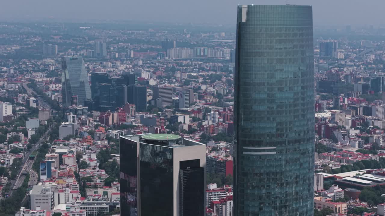 Morning aerial drone shot approaching Mexico City's Mitikah skyscraper