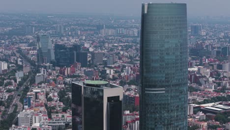 morning aerial drone shot approaching mexico city's mitikah skyscraper