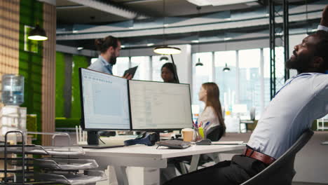 system administrator in tech startup office using pc, troubleshooting hardware