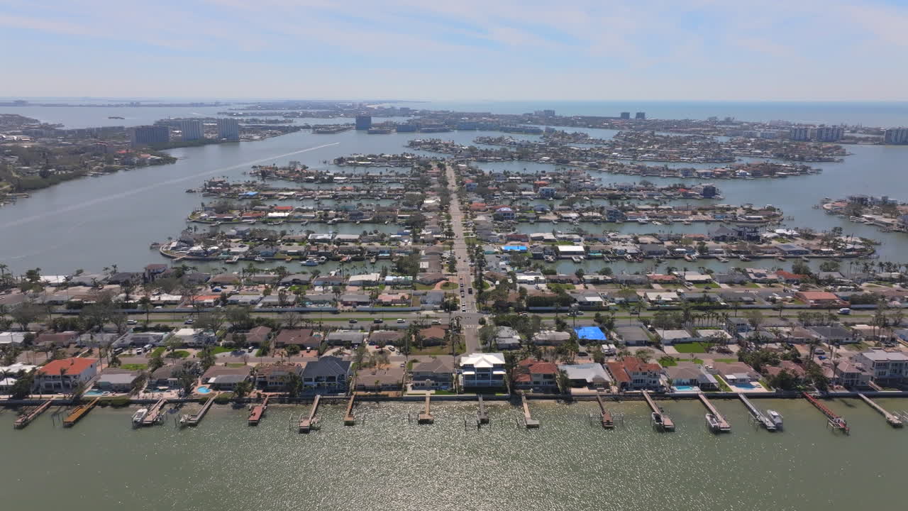 Florida Waterfront Luxury Island Neighborhood Aerial View Fly By on a sunny day