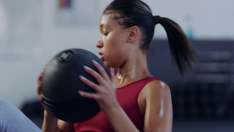 active young woman doing russian twists