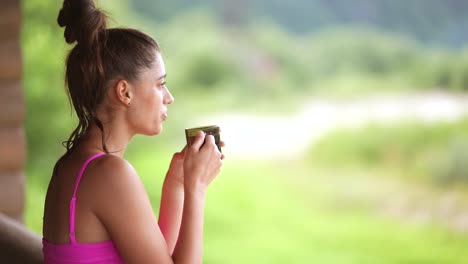 woman enjoying a drink outdoors