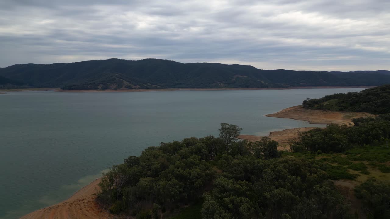 Right to left aerial view over Blowering Reservoir near Tumut in the Snowy Mountains Region of New South Wales.