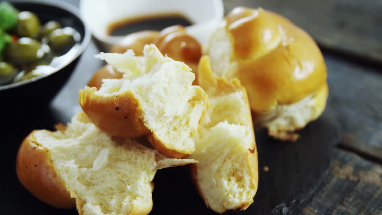 Pieces of bread and pickled olives