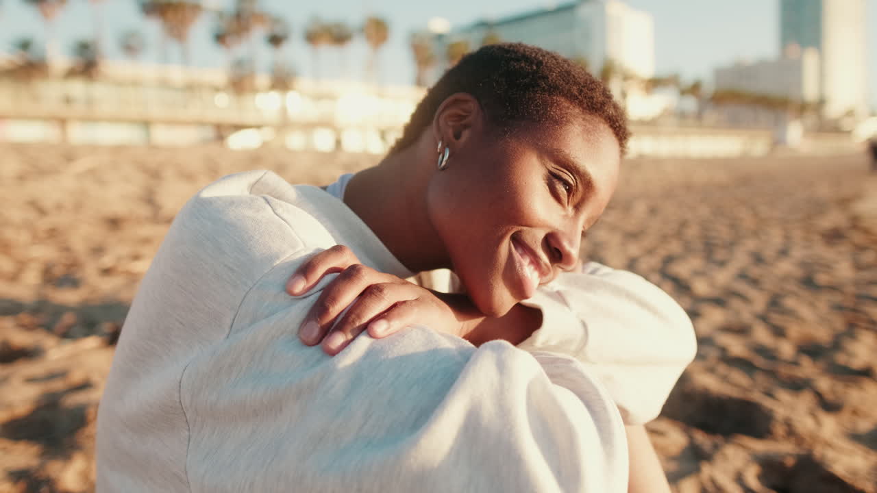 Happy Young African American Woman Smiling on Beach at Golden Hour