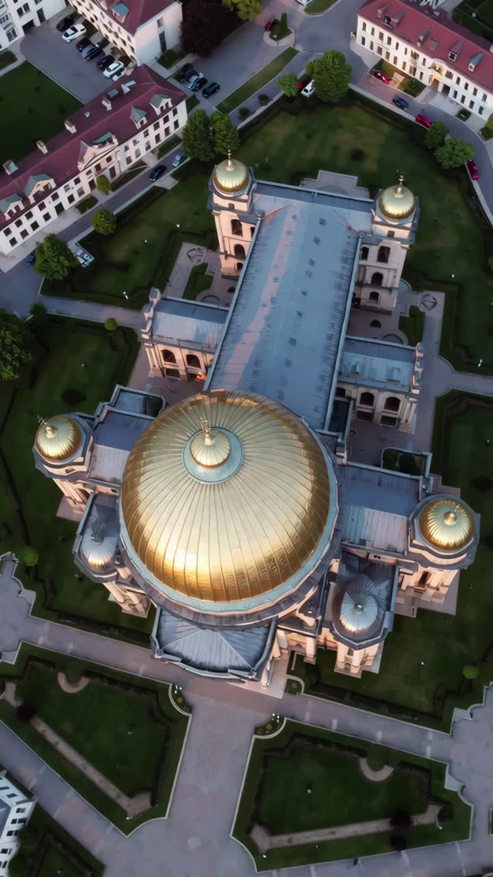 Aerial View of a Golden Domed Cathedral with Surrounding Cityscape