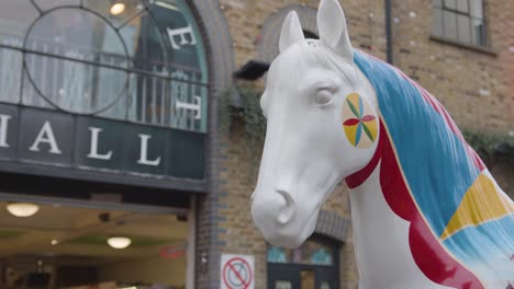 Painted-Sculpture-Of-Horse-Outside-Camden-Lock-Market-Hall-In-North-London-UK